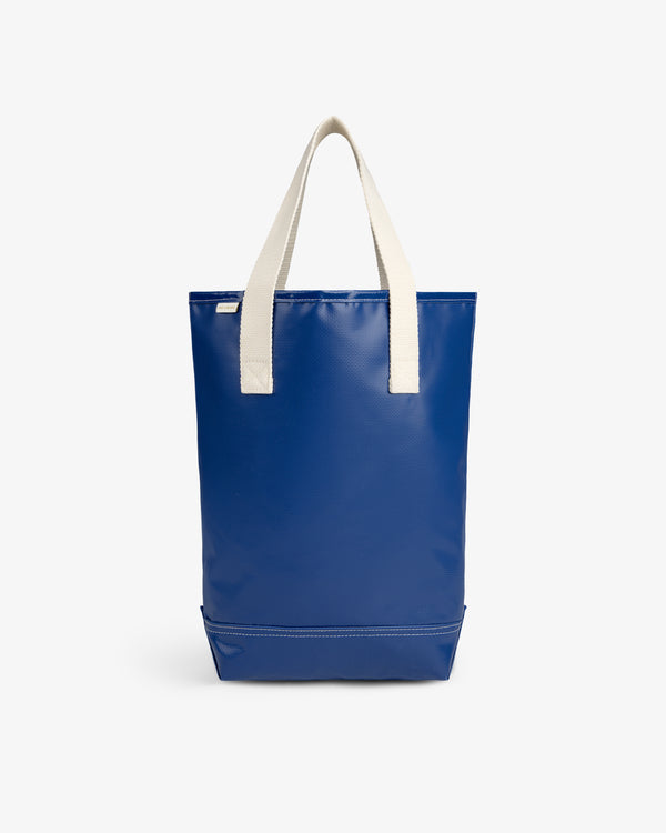 The Marina Bottle Tote, blue with off-white handles, displayed upright on a plain white background.
