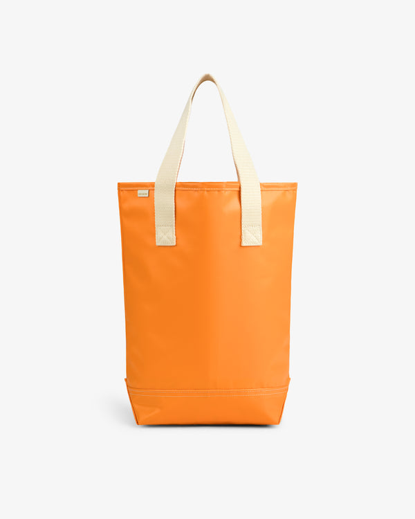 Marina Bottle Tote in bright orange with beige handles, shown upright on a plain white background.