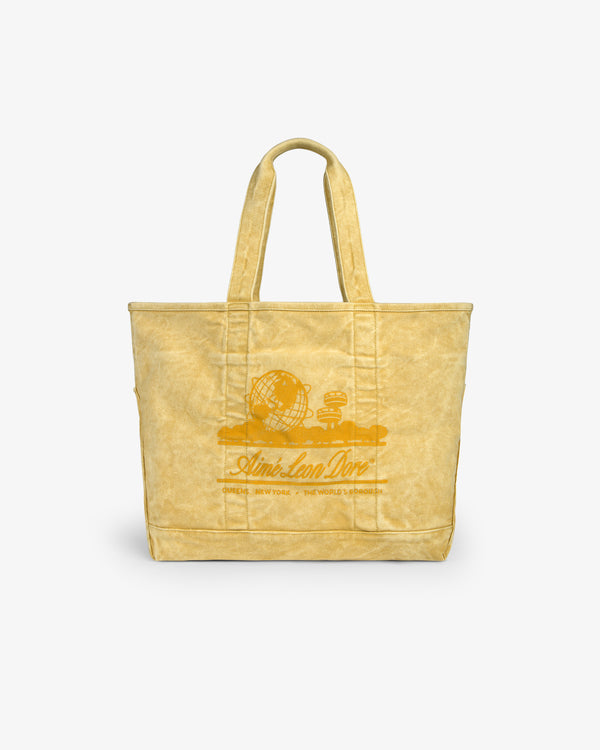 Sun Faded Large Unisphere Tote Bag with two handles and a printed globe graphic with text on the front.