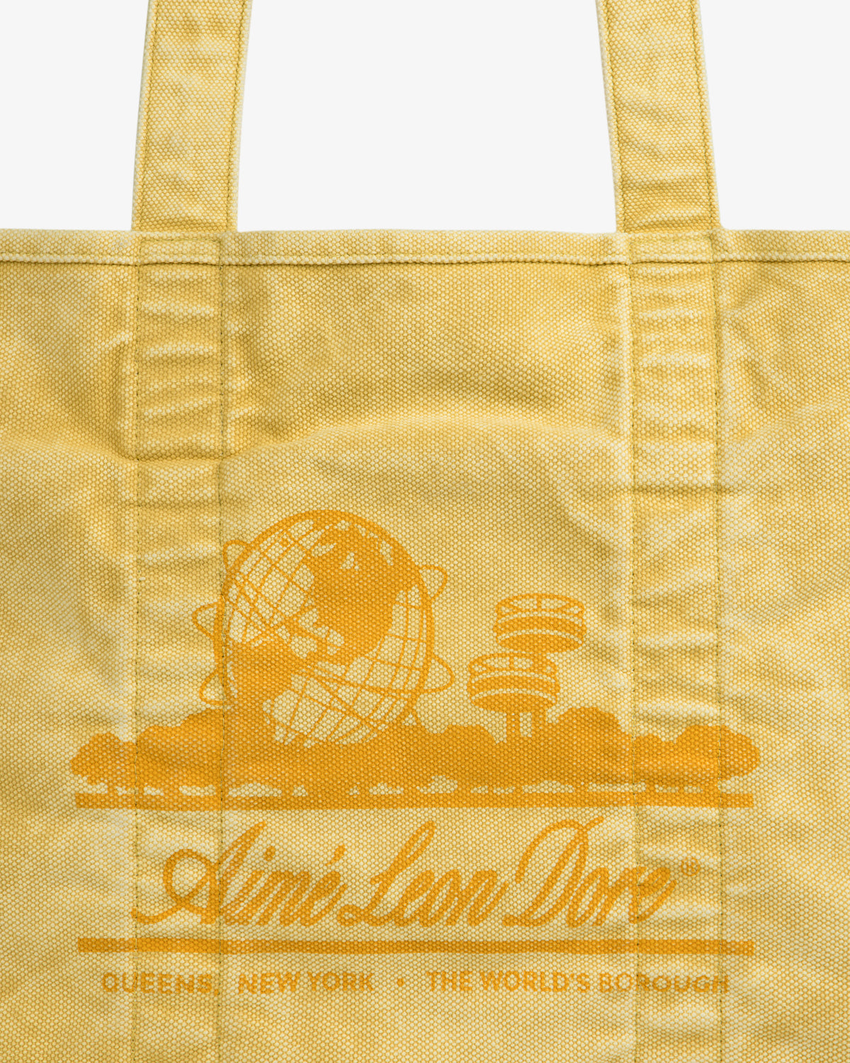 Sun Faded Large Unisphere Tote Bag with Queens illustration and “Ain’t Low Dov, Queens, New York” text.