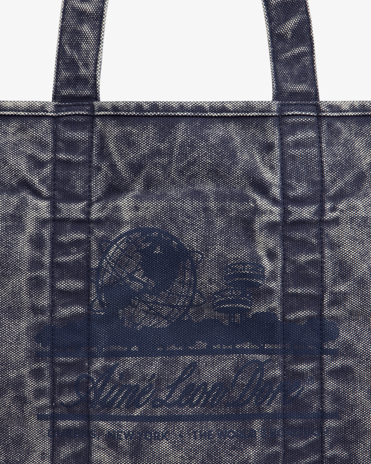 Sun Faded Large Unisphere Tote Bag with blue textured finish, two handles, and faint circular logo on the front.