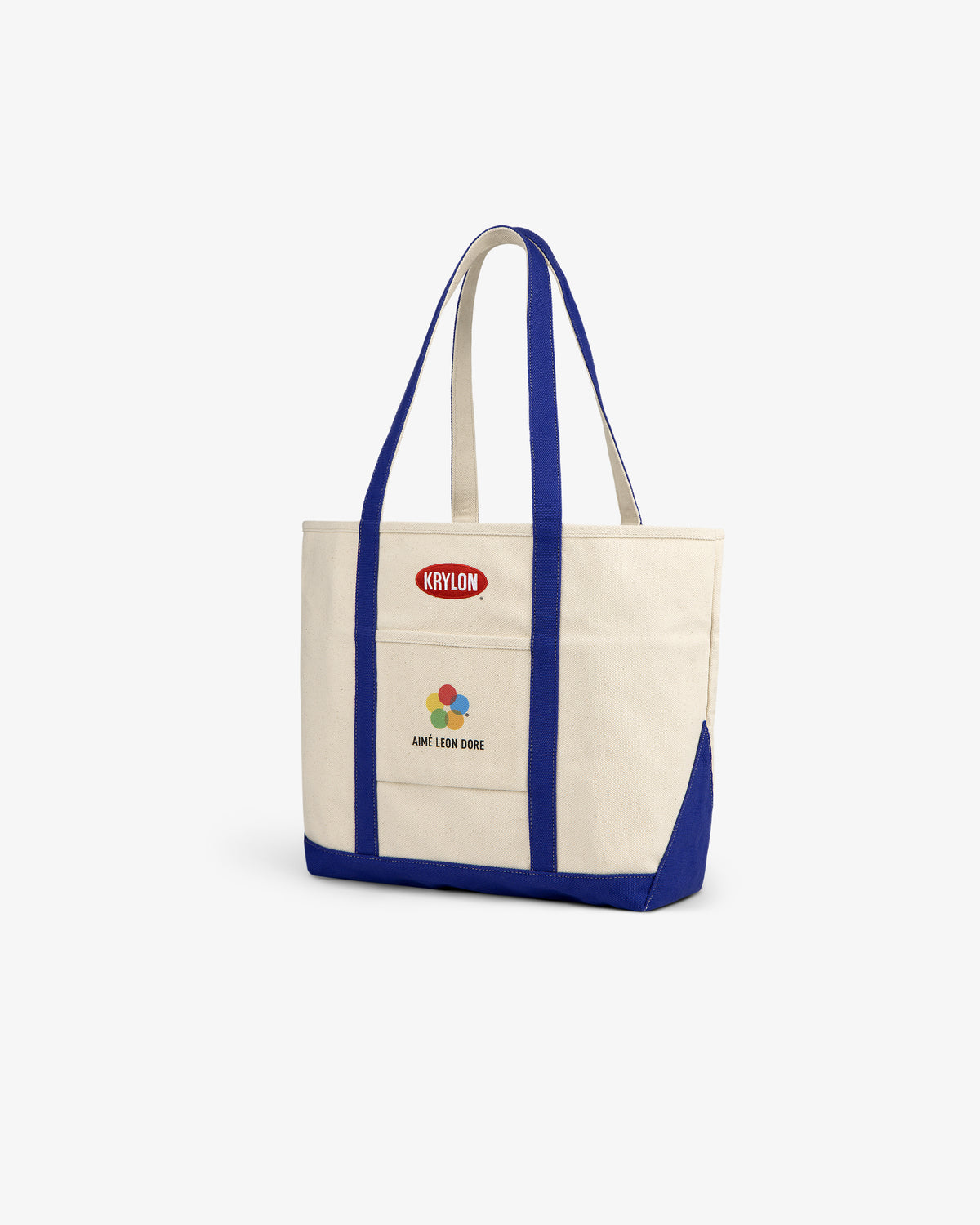 Krylon Tote Bag in beige with blue straps and trim, featuring Krylon and Aimé Leon Dore logos on the front.