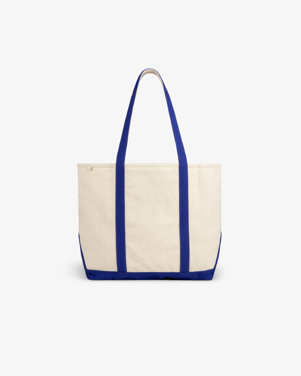 The Krylon Tote Bag is cream with blue handles and trim, shown on a plain white background.