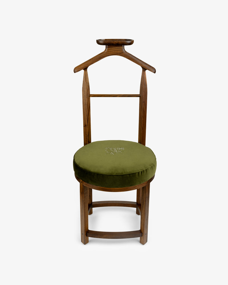 Queens Crest Valet Chair with a rounded olive-green cushioned seat and coat hanger-shaped backrest.