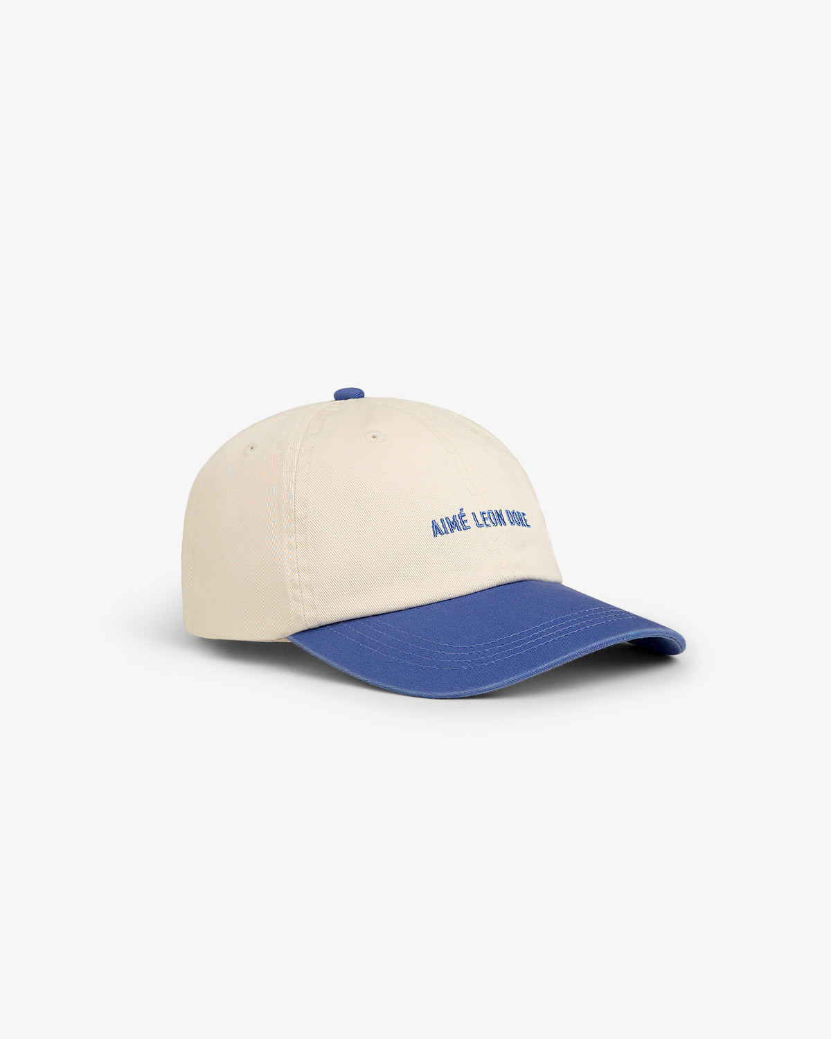 Washed Chino Hat in beige with blue brim and blue AIMÉ LEON DORE embroidery on the front.