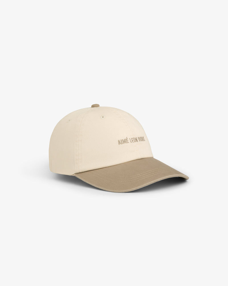 Washed Chino Hat in beige with a tan brim and subtle front text, shown on a white background.