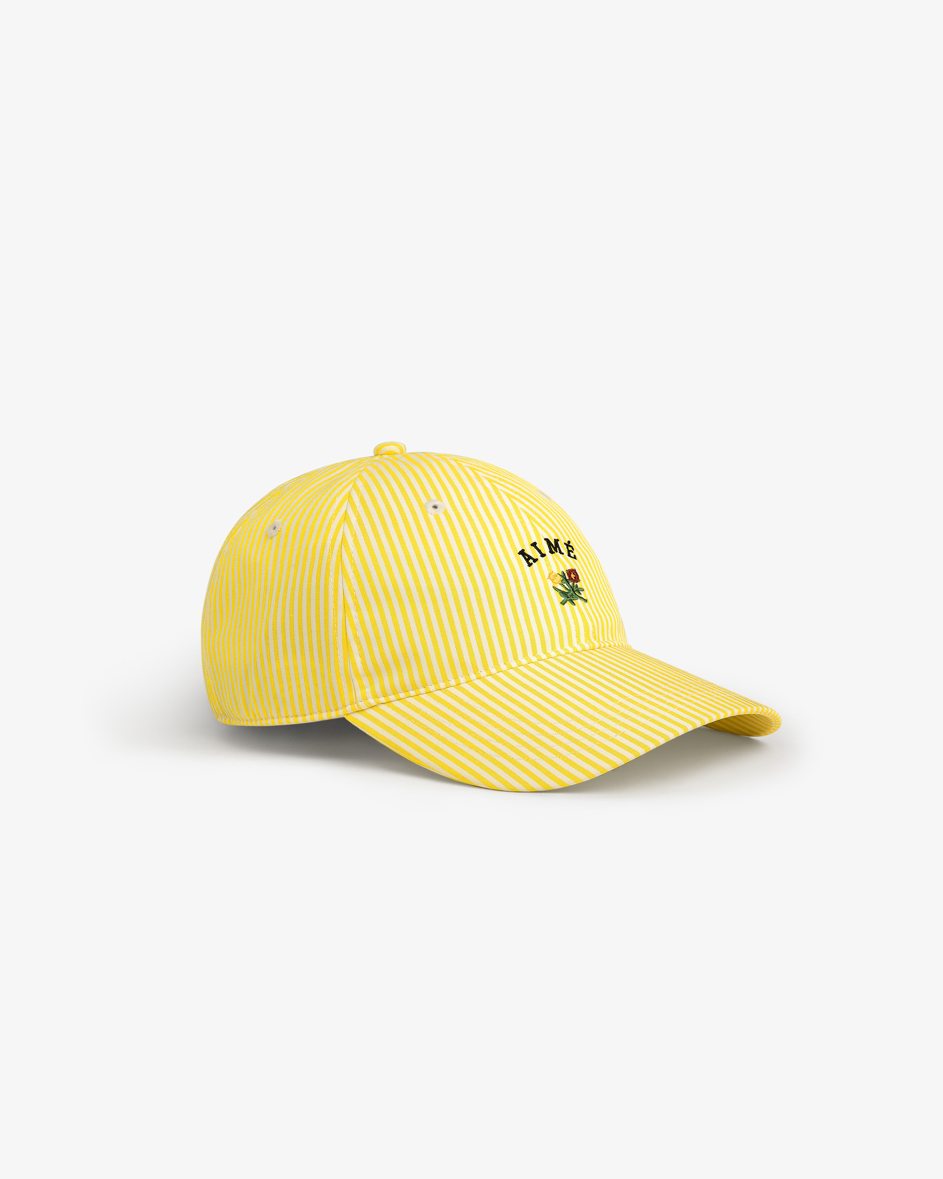 Striped Crest Logo Hat: Yellow-and-white stripes, small green palm tree, and L.A.M.B. logo embroidered on the front.