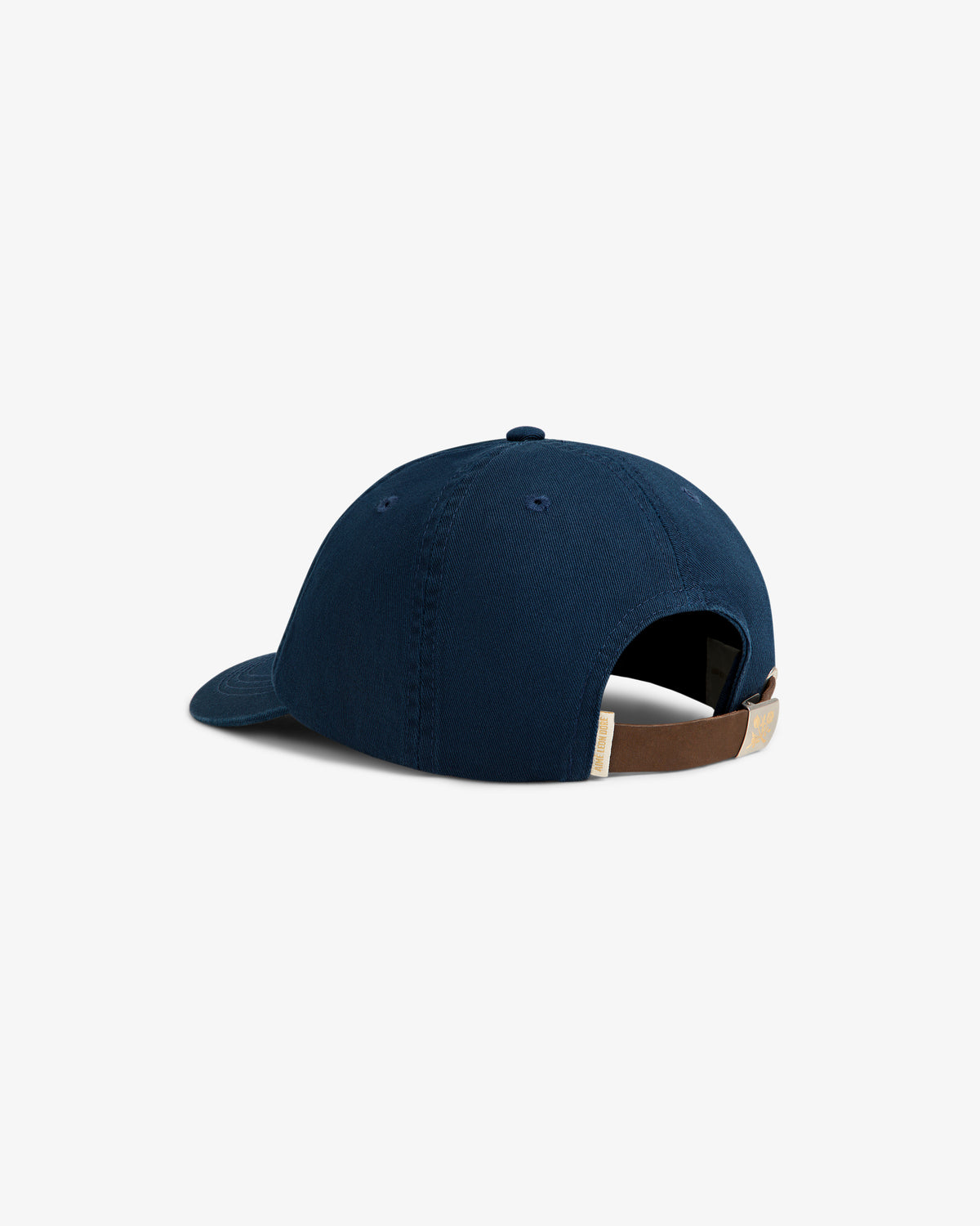 The Crest Logo Hat is shown from the back, featuring navy blue fabric and a brown adjustable strap.