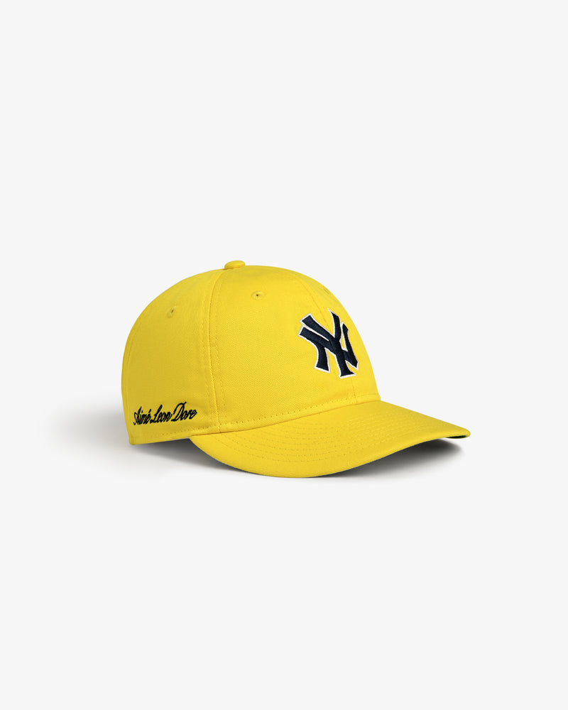 ALD / New Era Yankees Retro Fit Hat in bright yellow with a navy NY logo and black text on the brim's left side.