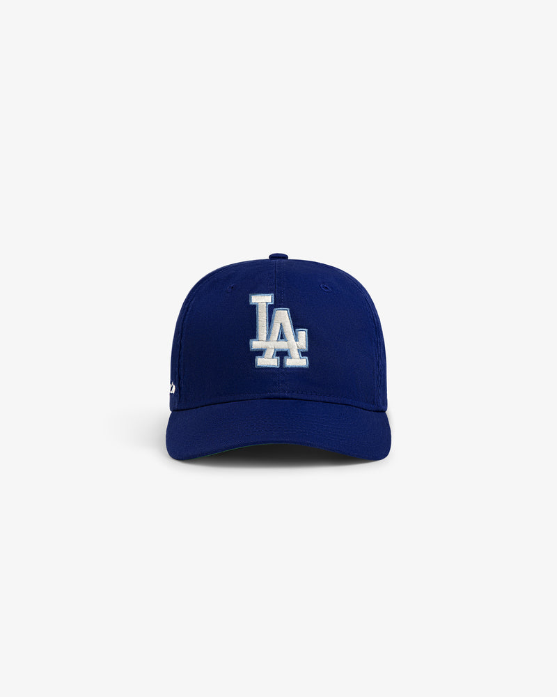 The ALD / New Era Dodgers Retro Fit Hat is blue with a white LA logo, shown on a plain white background.