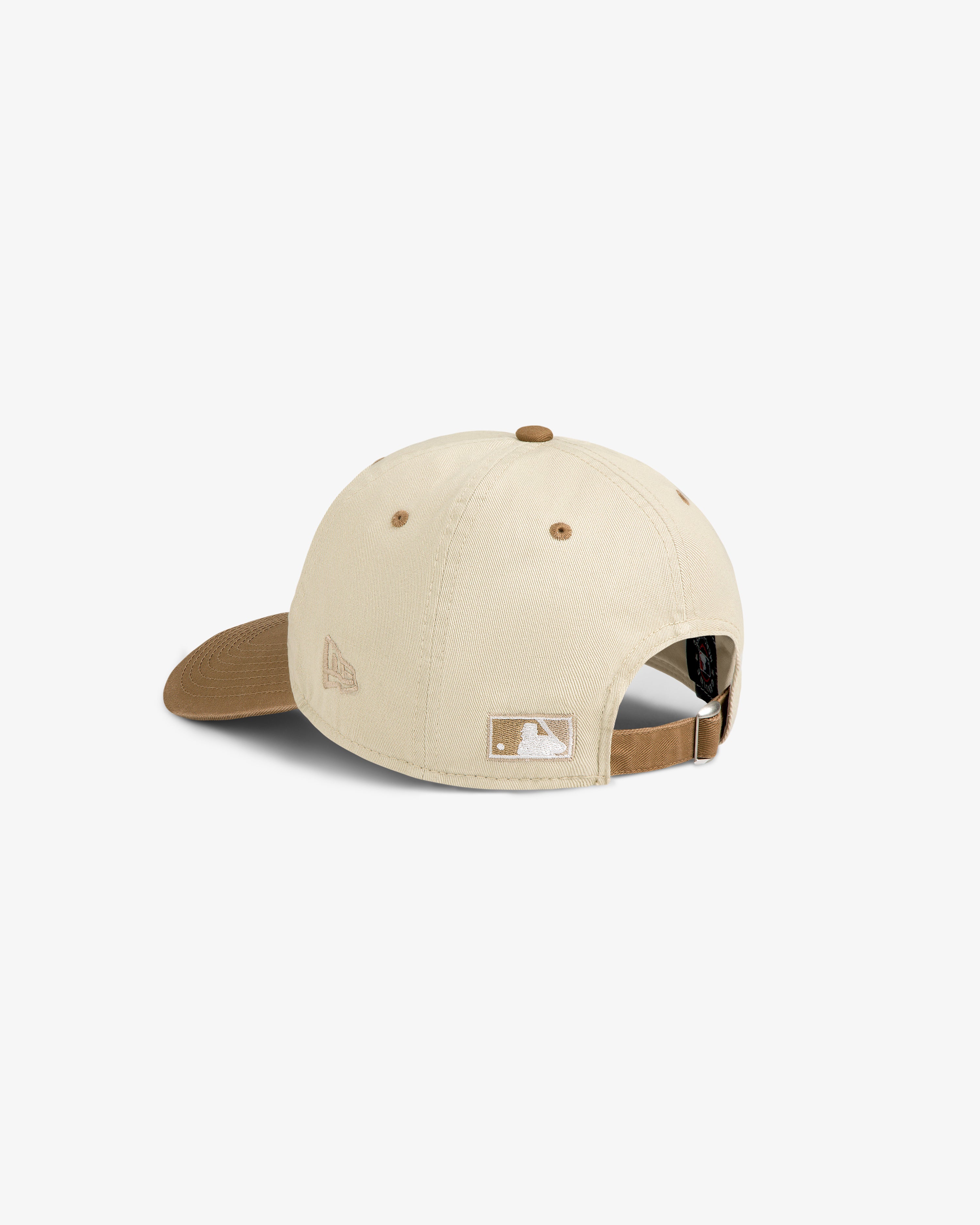The ALD / New York Mets Colorblock Ballpark Hat is beige with a brown brim, adjustable strap, and small embroidered logos.