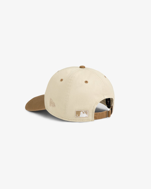 The ALD / New York Mets Colorblock Ballpark Hat is beige with a brown brim, adjustable strap, and small embroidered logos.