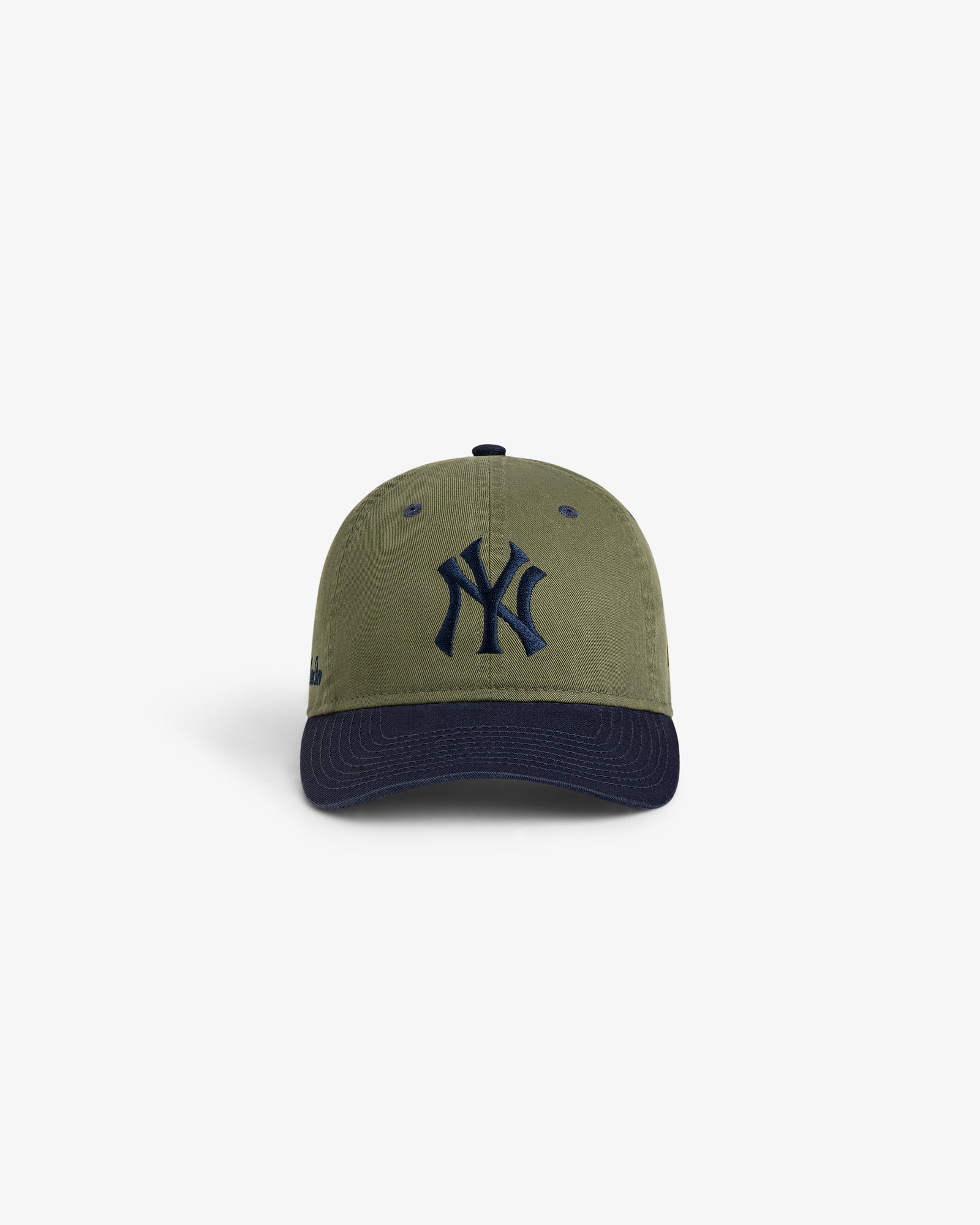 ALD / New York Yankees Colorblock Ballpark Hat in olive green with navy brim and NY logo, shown on white background.