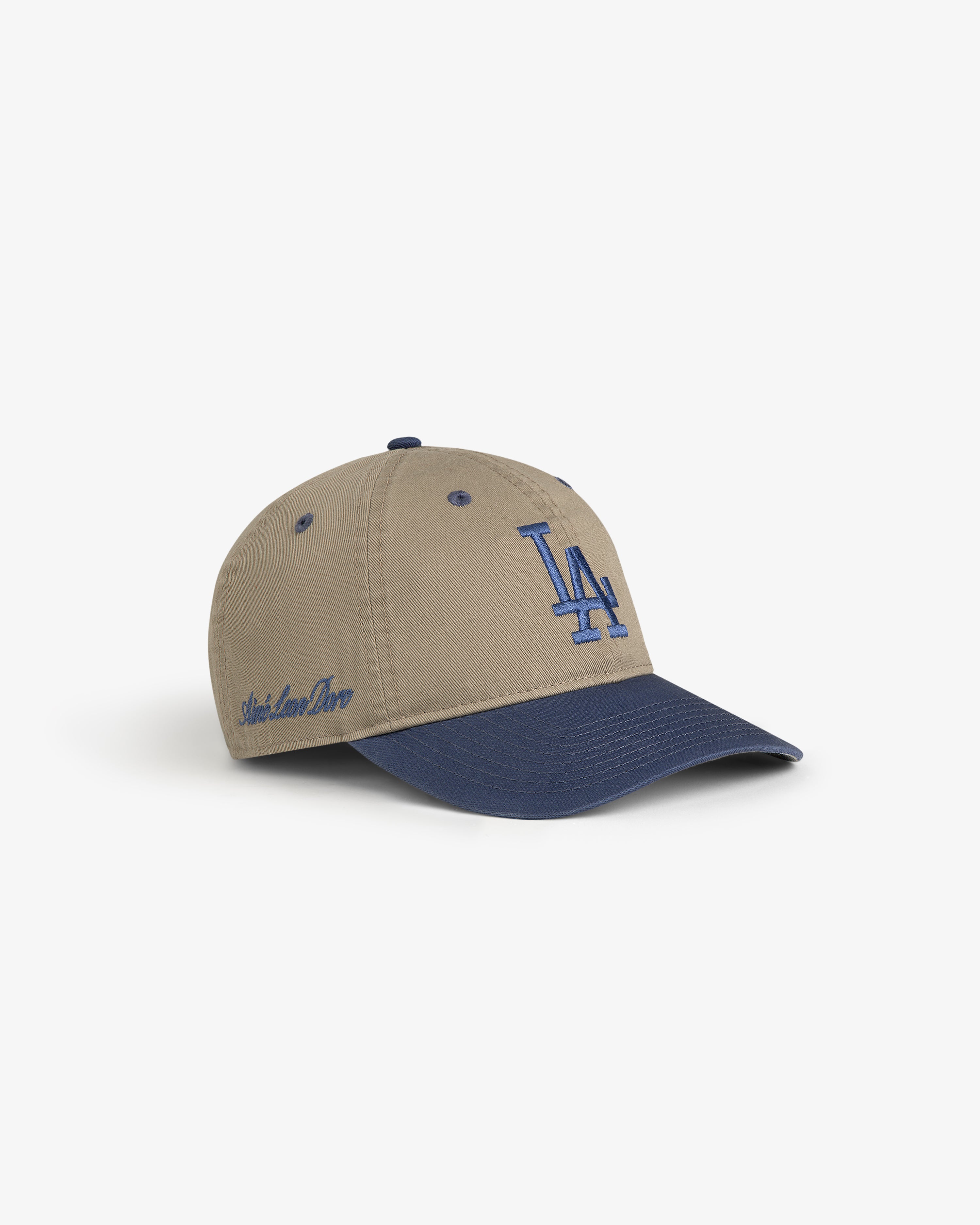 ALD / LA Dodgers Colorblock Ballpark Hat with beige/navy panels, LA logo front, and Aimé Leon Dore on the side.