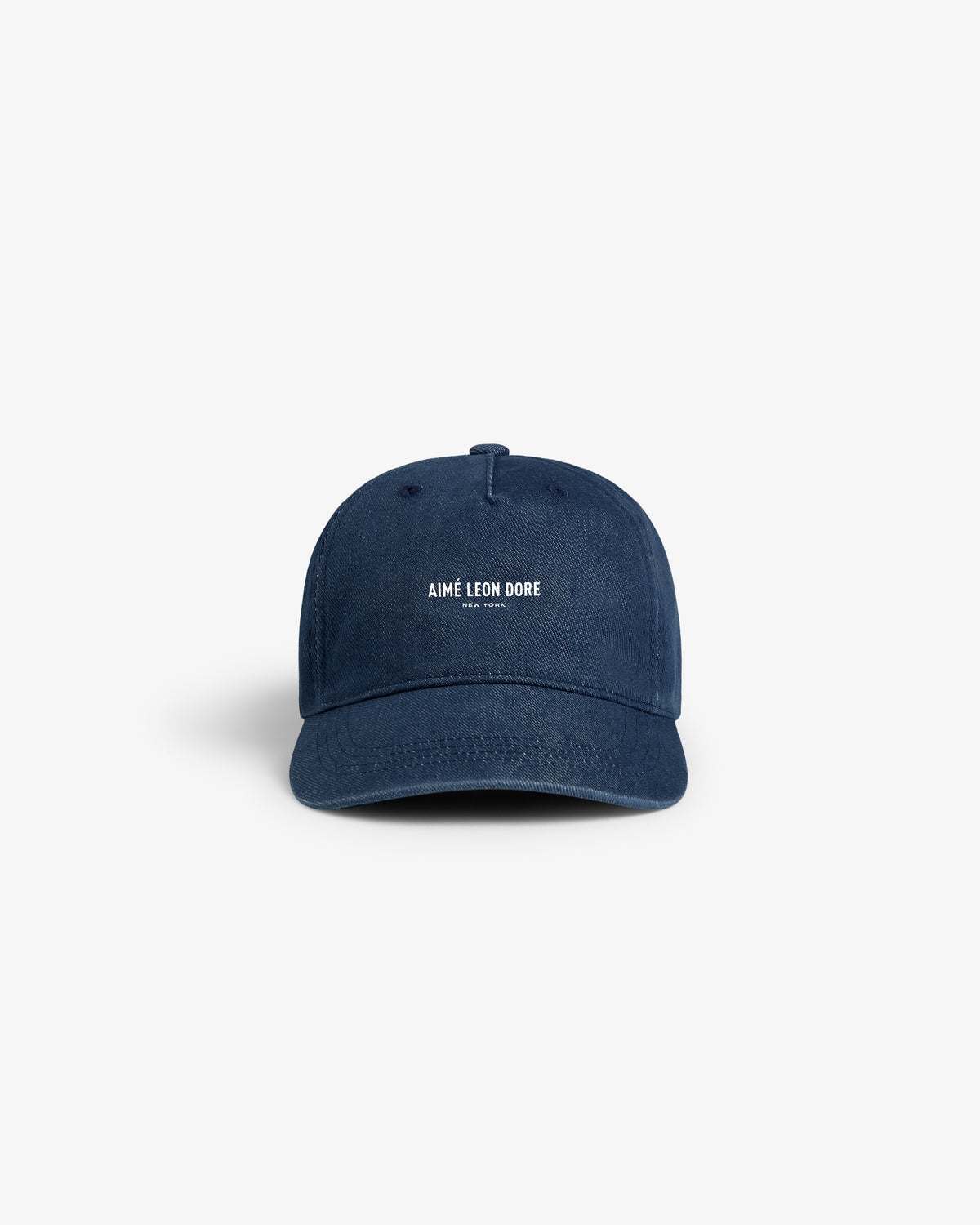 Vintage Micro Logo Hat in navy blue with white AIMÉ LEON DORE text on the front, displayed on a white background.