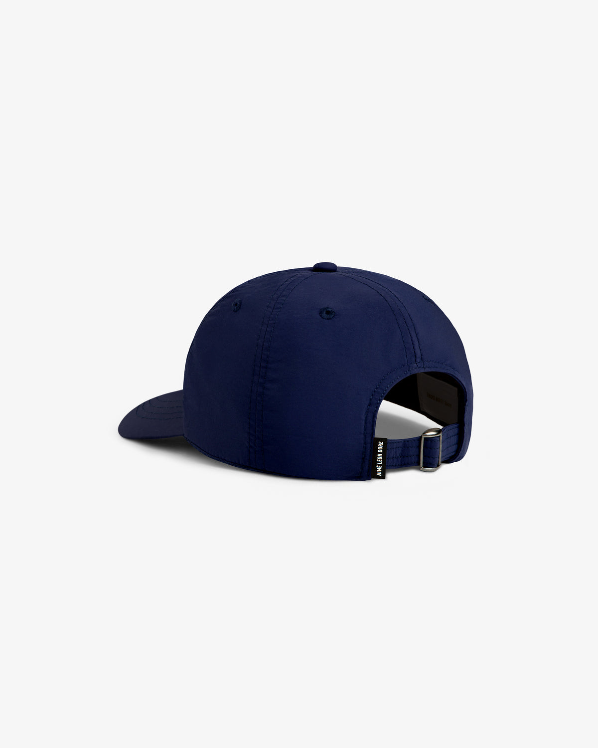The Nylon Crusher Hat in navy blue is shown from the back, featuring an adjustable strap and a small black label.