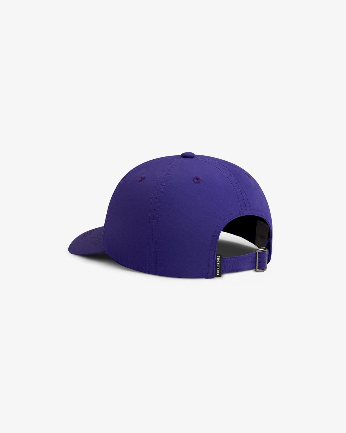 A purple Nylon Crusher Hat shown from the back with an adjustable strap and a small black tag on the band.