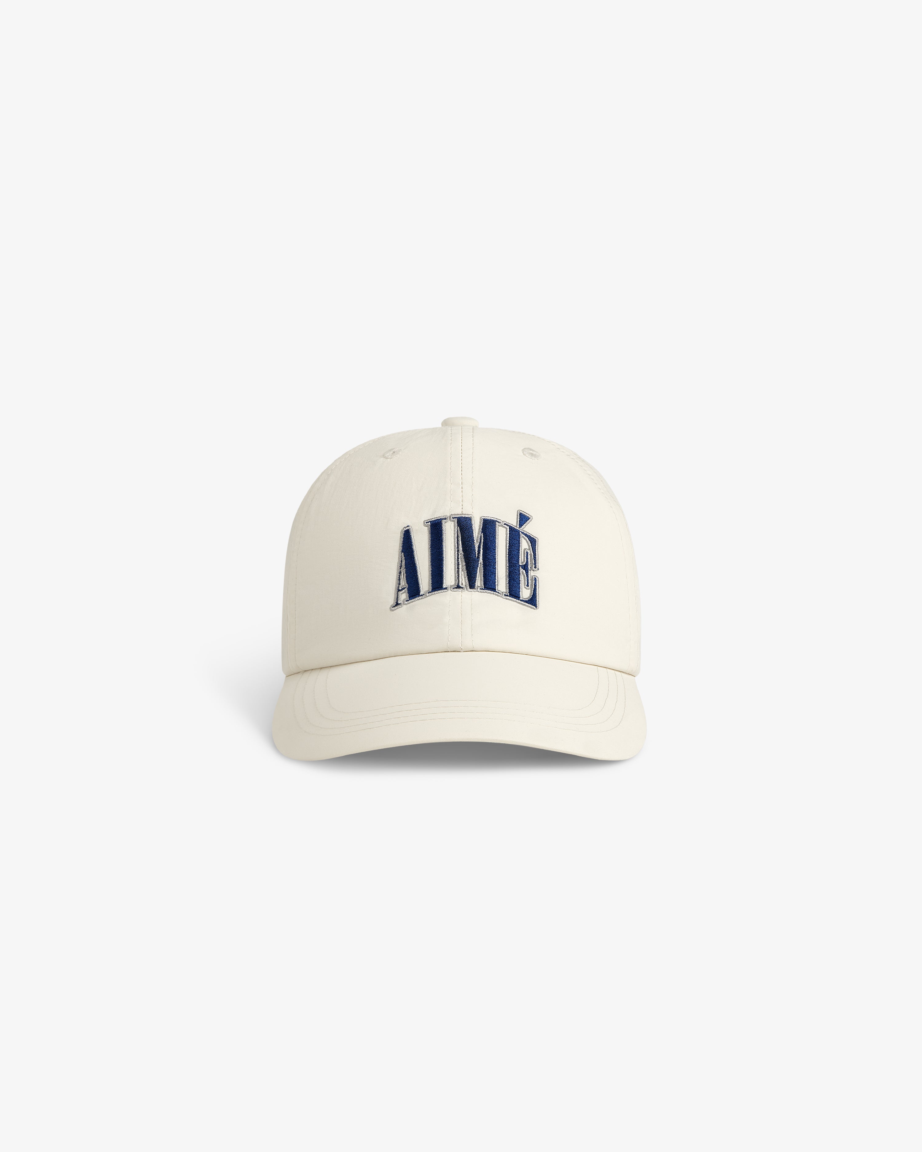 Nylon Crusher Hat in off-white with AIMÉ embroidered in large navy letters on the front, front view.