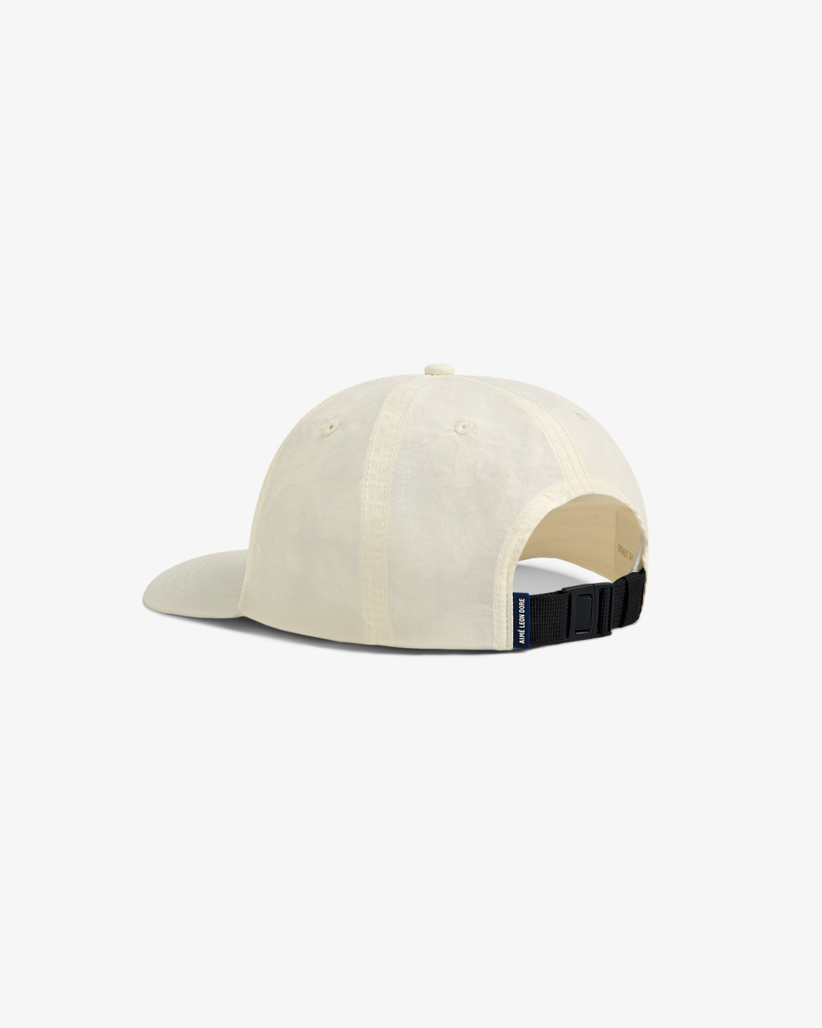 Back view of Nylon Sport Hat in beige with an adjustable black strap and small blue tag on white background.