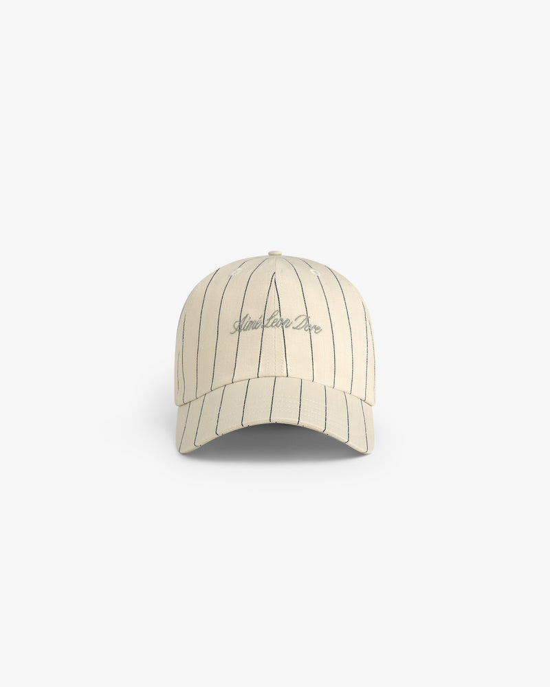 Pinstripe Suiting Hat in beige with black stripes and Limelight Deco front embroidery, shown on white background.