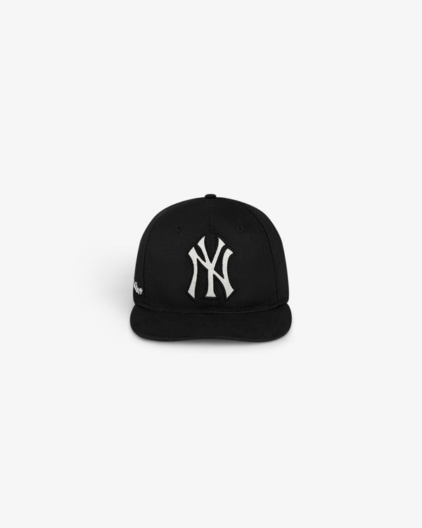 ALD / New York Yankees Retro Fit Hat in black with a white Yankees logo, front view on plain background.