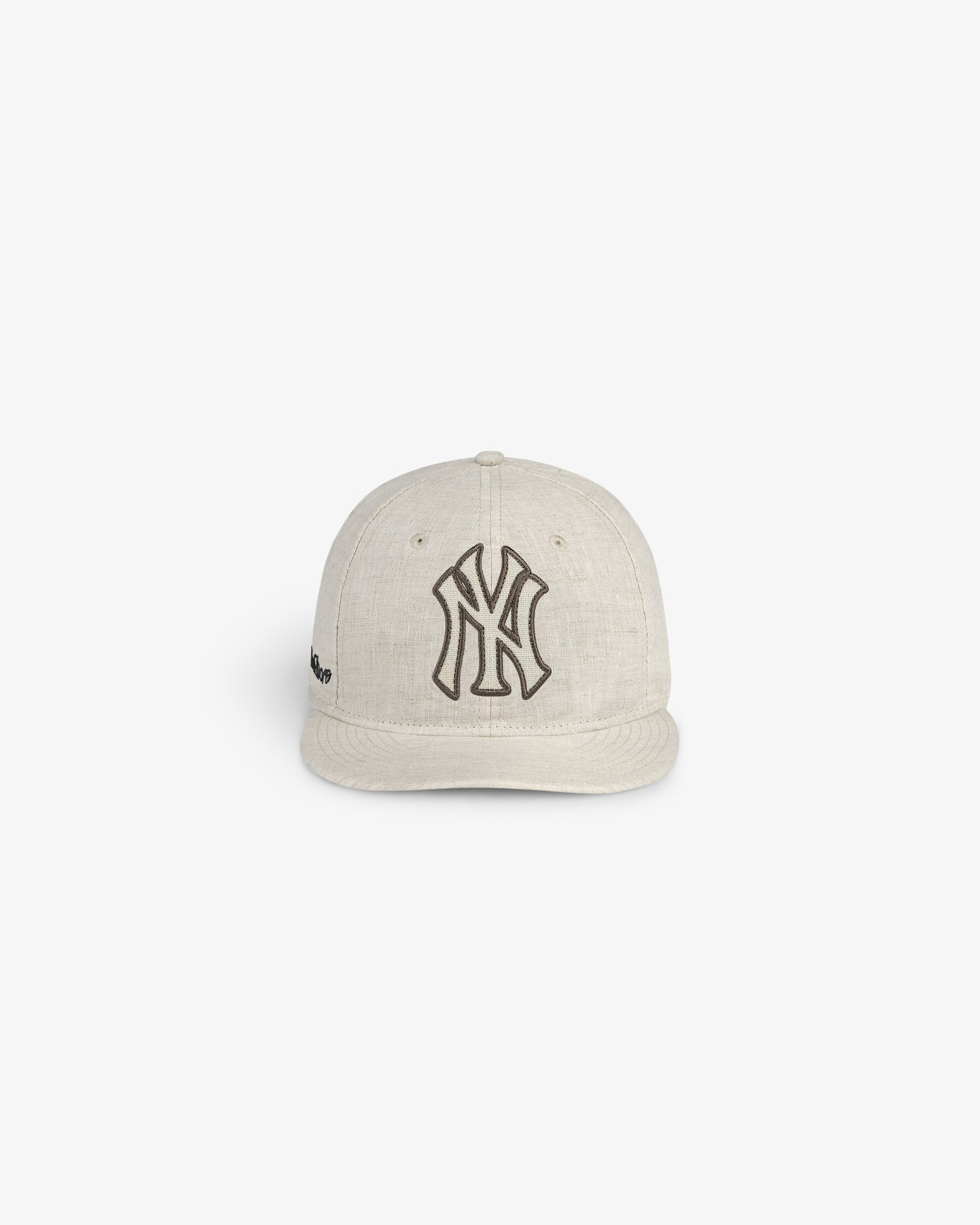 ALD / New York Yankees Retro Fit Hat in beige with a black Yankees logo, shown against a white background.