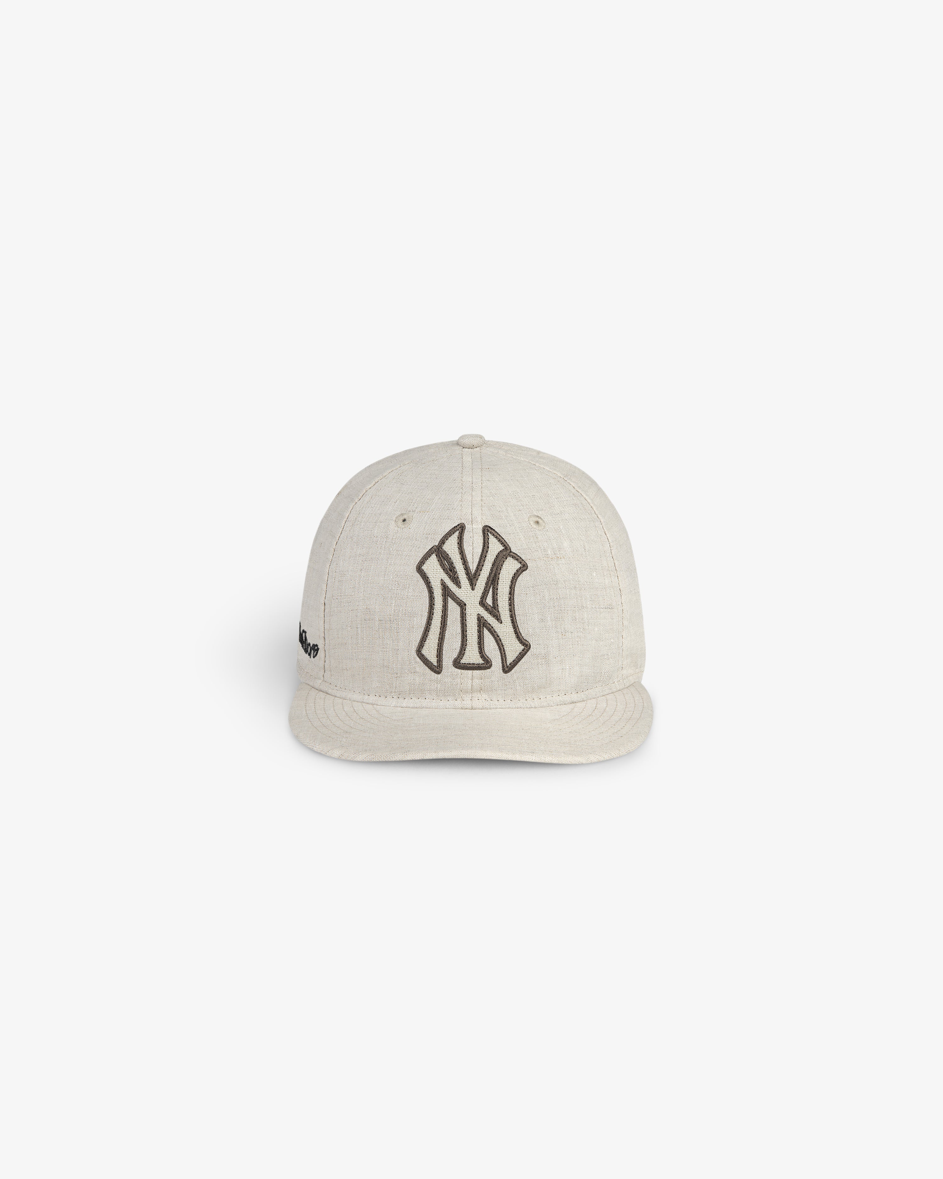 ALD / New York Yankees Retro Fit Hat in beige with a black Yankees logo, shown against a white background.