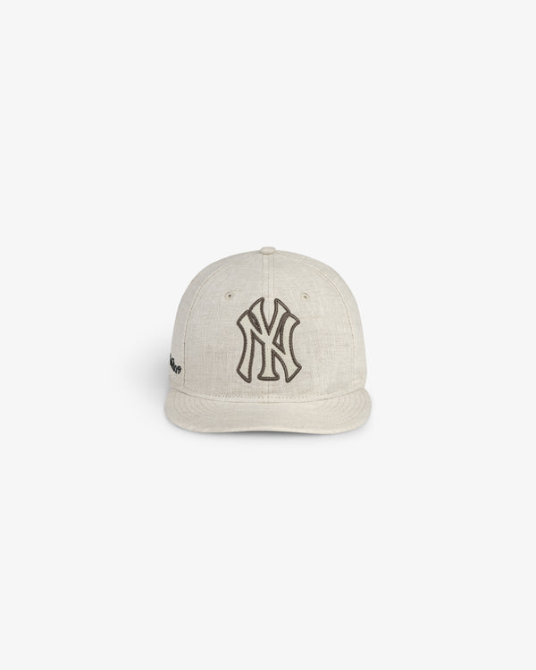 ALD / New York Yankees Retro Fit Hat in beige with a black Yankees logo, shown against a white background.