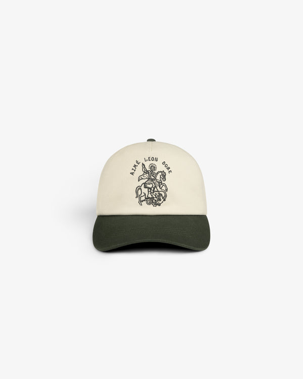 Cream and dark green Saint George Logo Hat with an embroidered graphic and SAVE LEON ORE on the front.