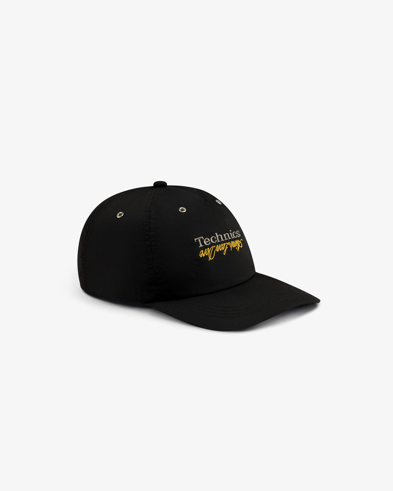 ALD / Technics Nylon Logo Hat: black cap with "Technics everyday wraps" embroidered in white and yellow on front.