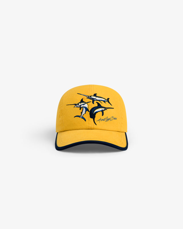 Souvenir Fishing Hat: yellow cap with three embroidered marlins and cursive text on the front, front view.