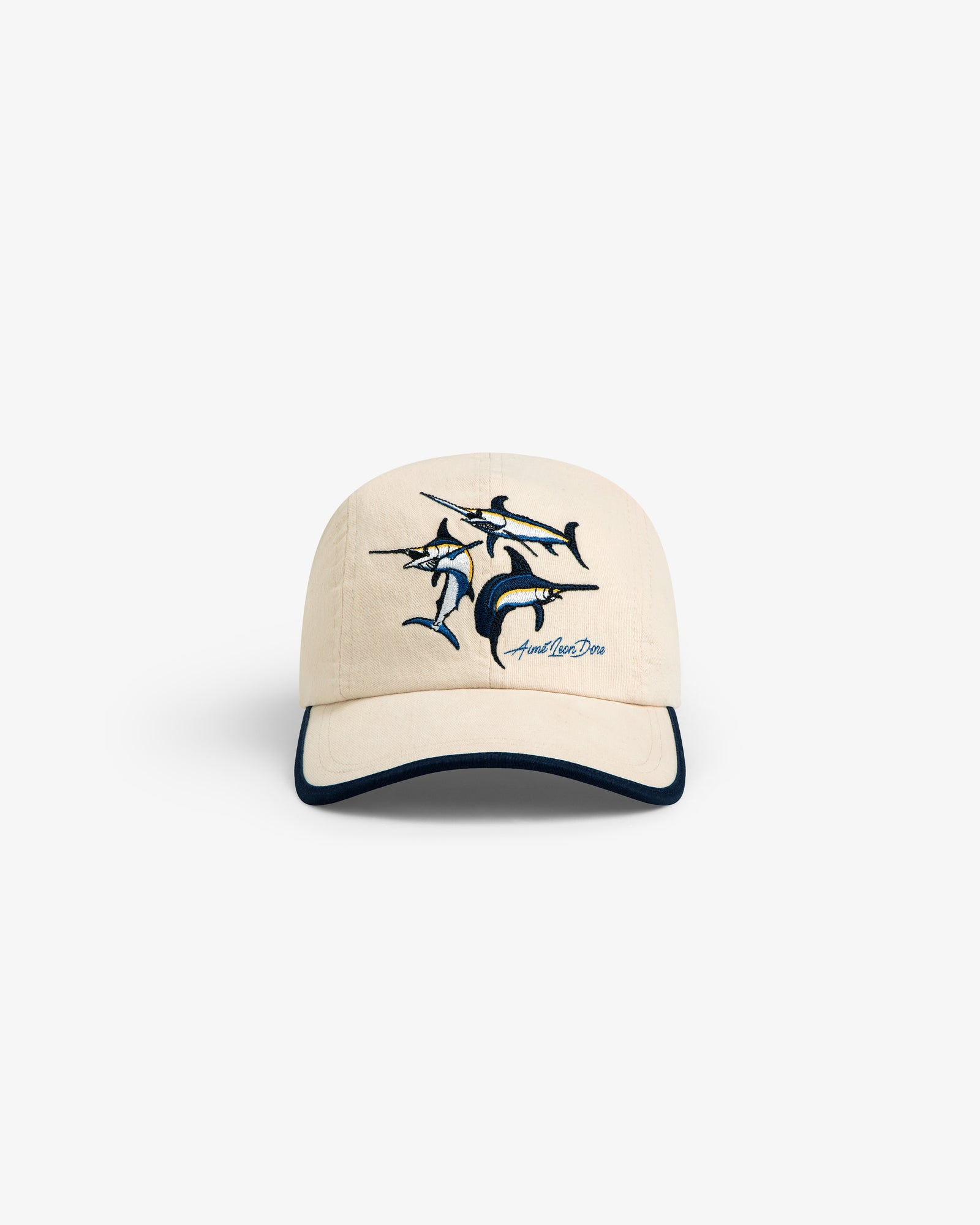 Souvenir Fishing Hat: beige baseball cap with embroidered marlin and dark-trimmed visor, shown on white background.