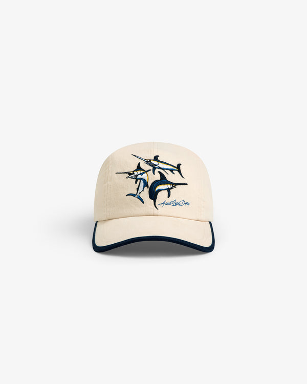 Souvenir Fishing Hat: beige baseball cap with embroidered marlin and dark-trimmed visor, shown on white background.