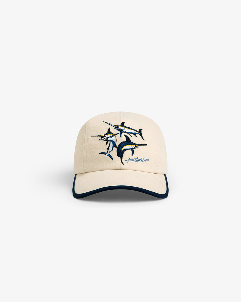 Souvenir Fishing Hat: beige baseball cap with embroidered marlin and dark-trimmed visor, shown on white background.