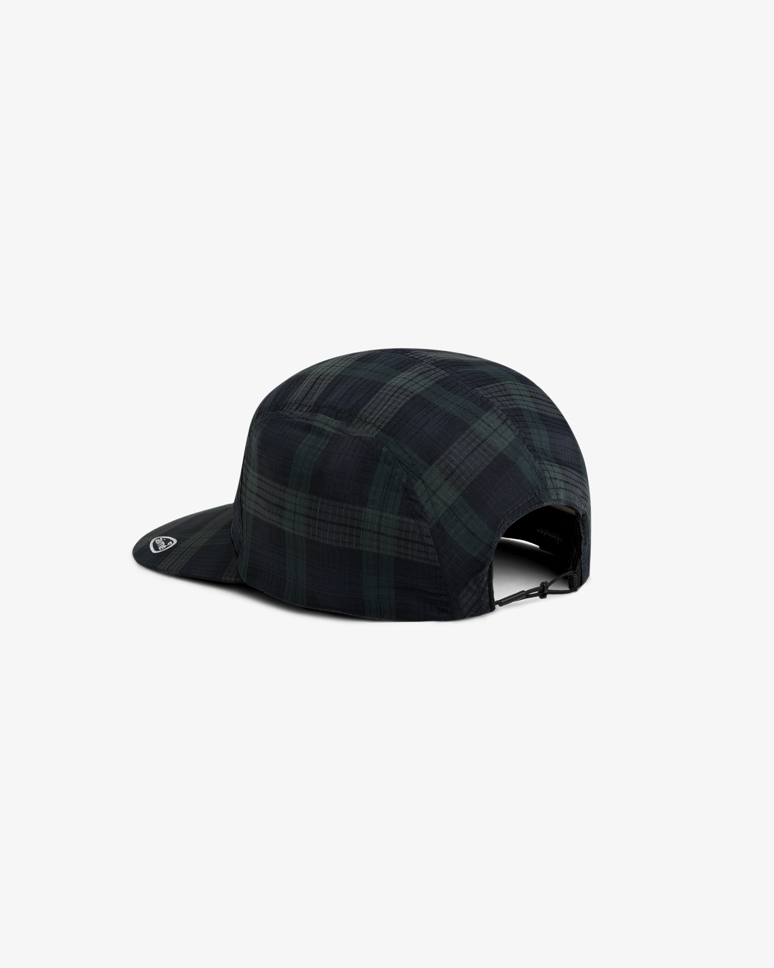 The ALD Golf Performance Sport Hat is a black and green plaid five-panel cap with an adjustable strap.
