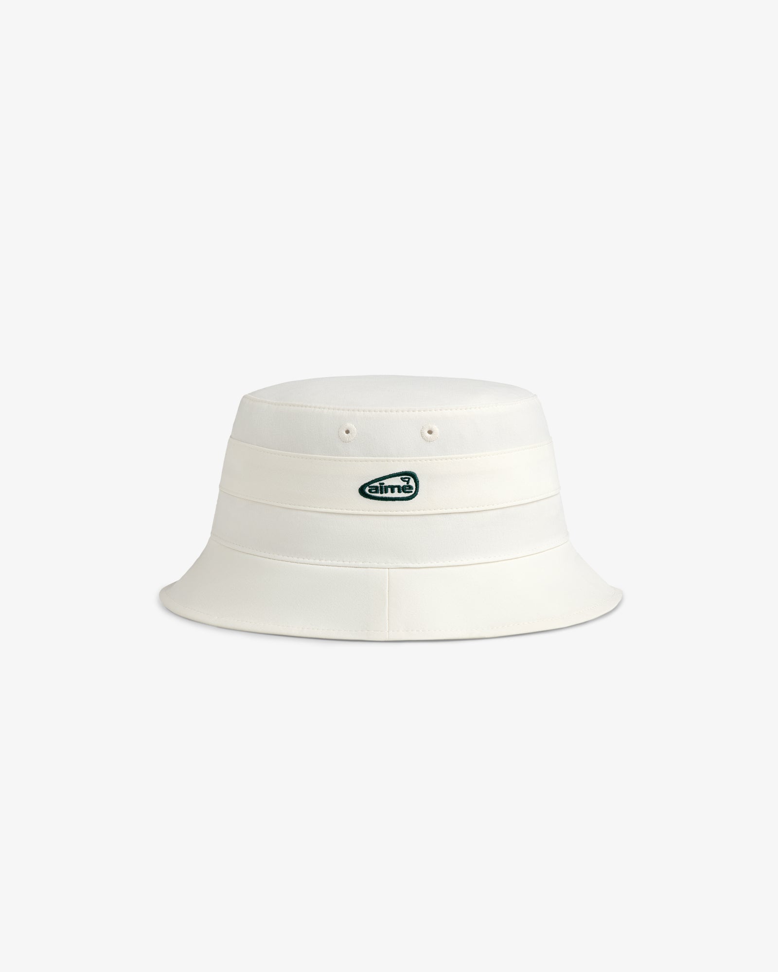 ALD Golf Bucket Hat in off-white with small green and white oval logo patch on front, shown on white background.