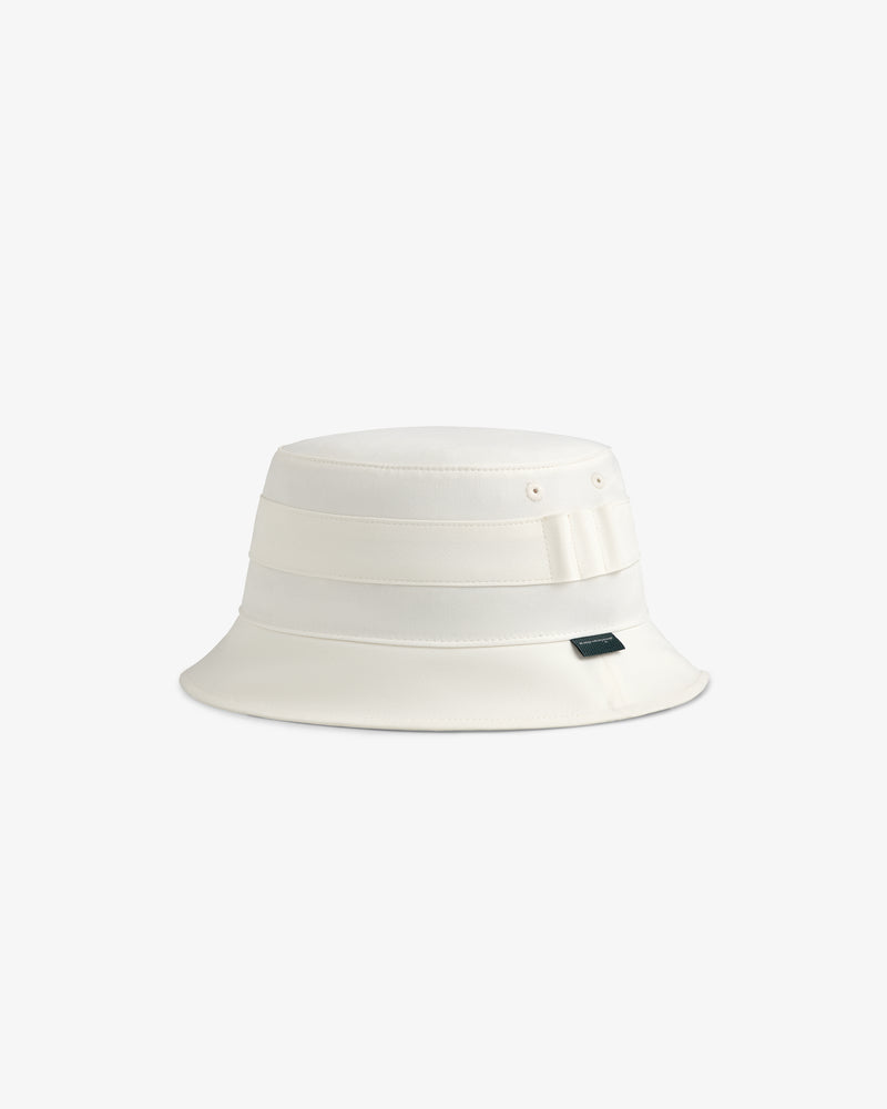 ALD Golf Bucket Hat with wide brim, ribbon detail, and side label on a plain background.