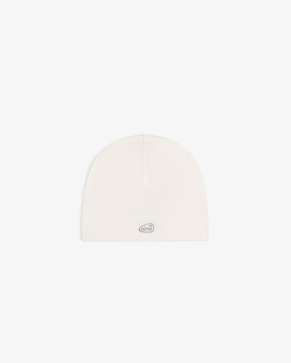The ALD Golf Skull Cap is a plain white beanie with a small gray oval logo on the front, shown on a white background.
