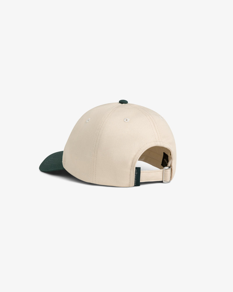 ALD Golf Logo Hat in beige with green brim, shown from the back with adjustable strap and metal buckle.