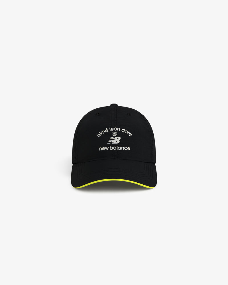ALD / New Balance Running Hat with white logos and yellow trim on the brim.