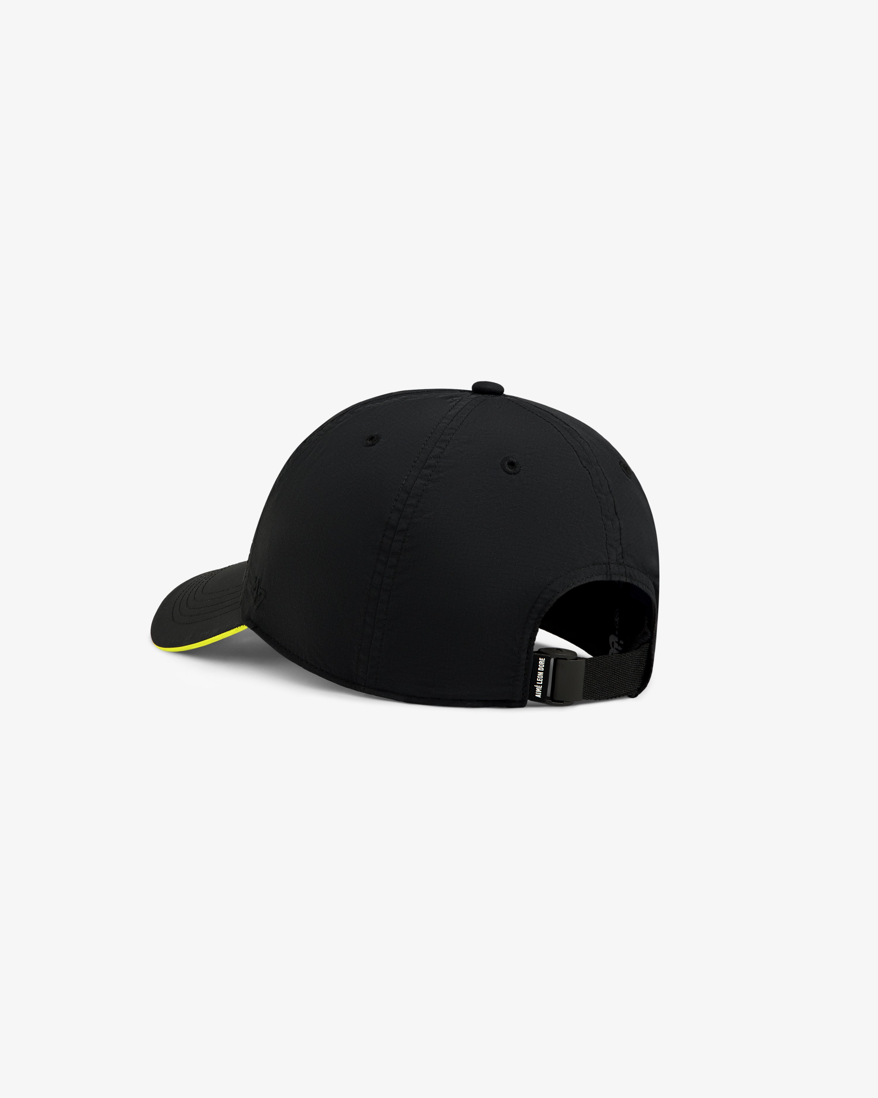 ALD / New Balance Running Hat in black with yellow-edged curved brim, adjustable back strap, and buckle.