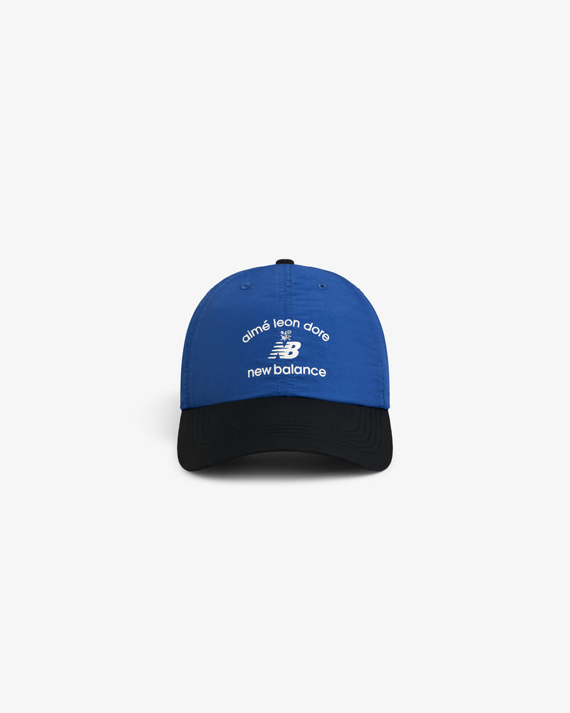 Blue and black ALD / New Balance Running Hat with white embroidered logos on the front.