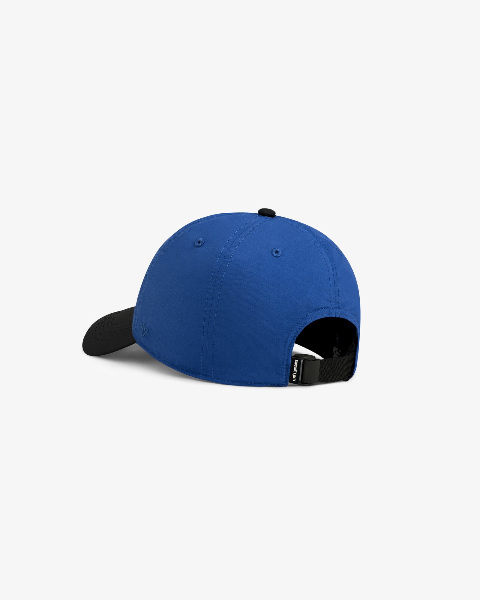 ALD / New Balance Running Hat in blue with black brim, back view, adjustable strap, and small black tag.