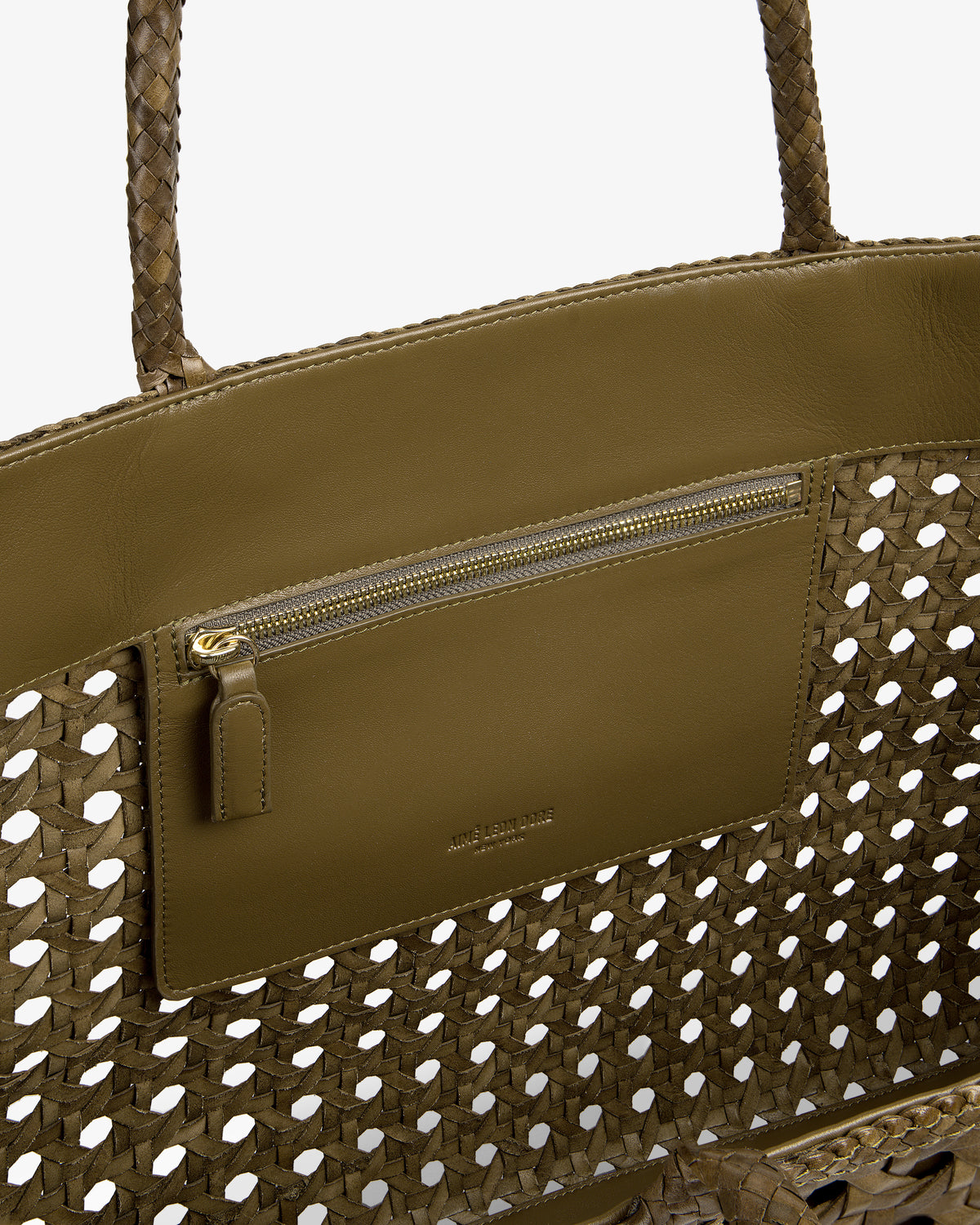 Interior view of the Woven Leather Tote Bag in olive green, featuring a zip pocket and leather trim.