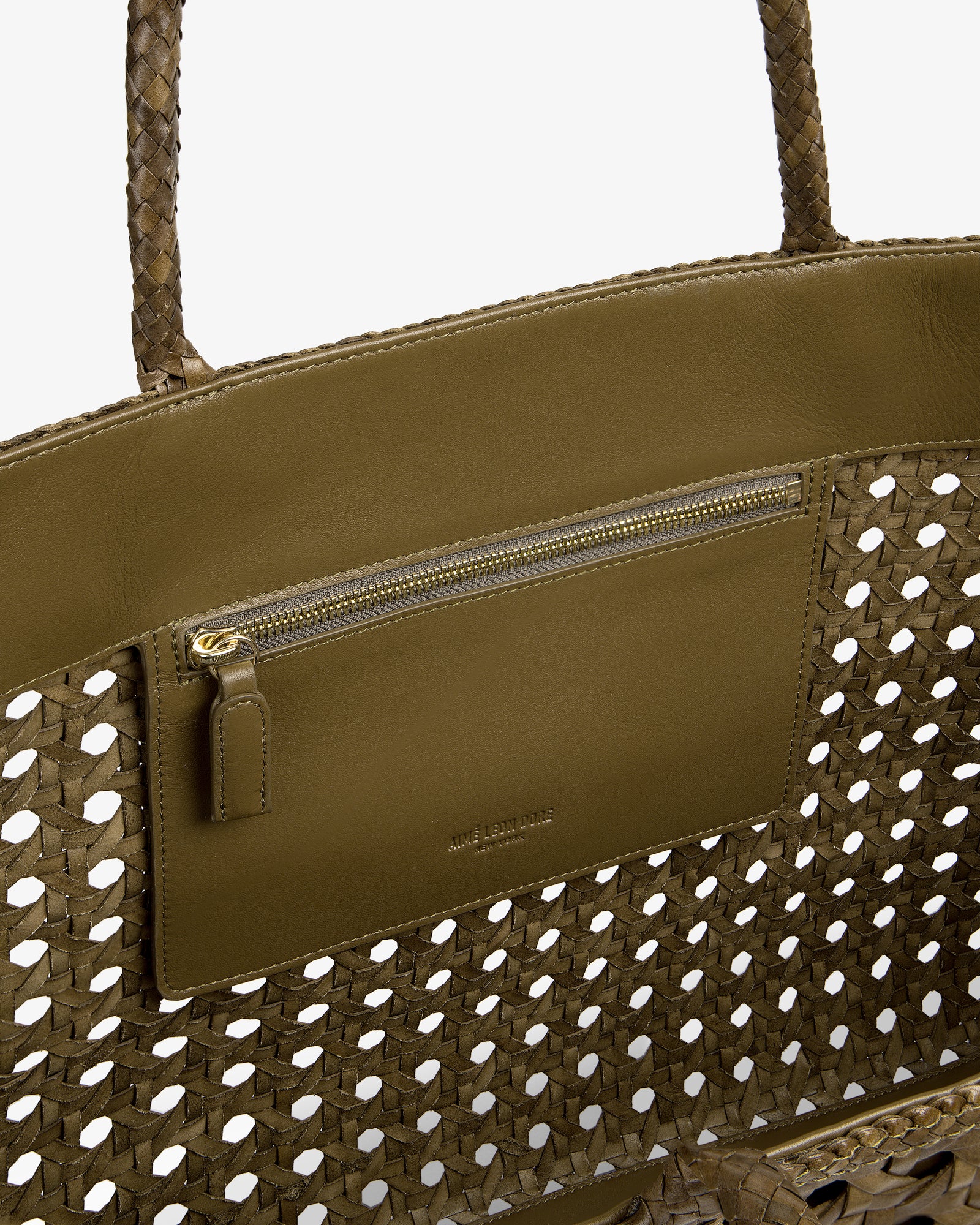 Interior view of the Woven Leather Tote Bag in olive green, featuring a zip pocket and leather trim.