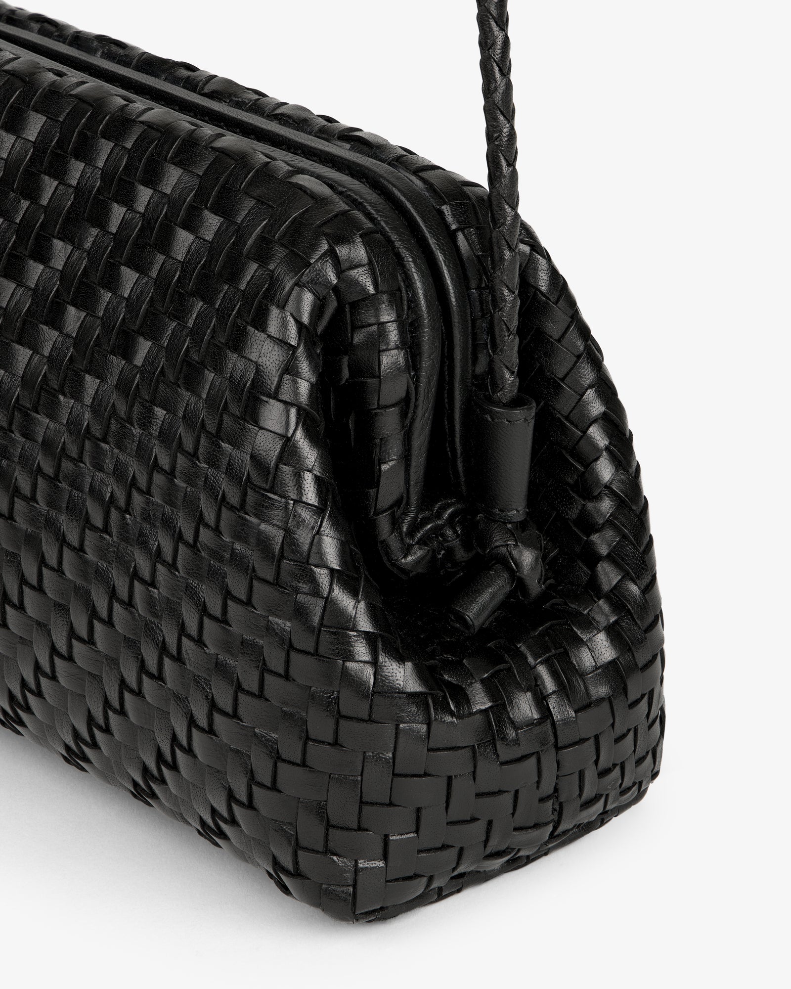 Close-up of the Woven Leather Shoulder Bag in black, featuring a drawstring and detailed woven texture.