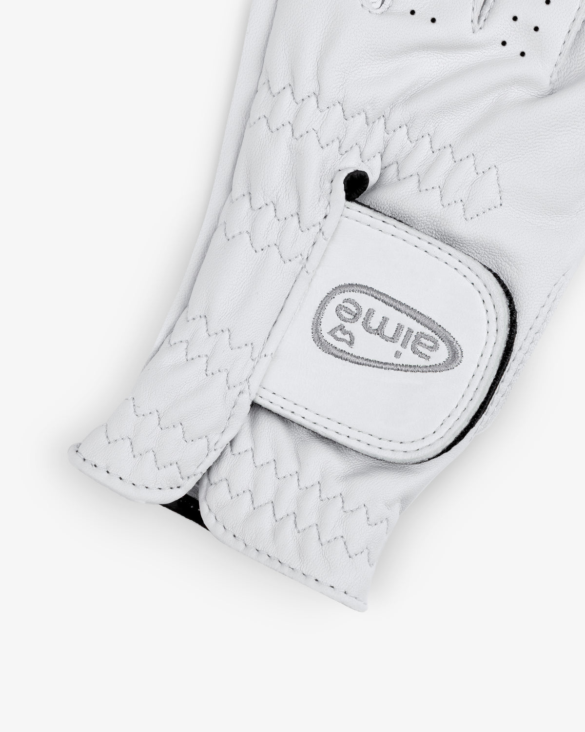 A close-up of the ALD / FootJoy StaSof Heritage Glove (Left) with a Velcro strap labeled "elime" in gray.