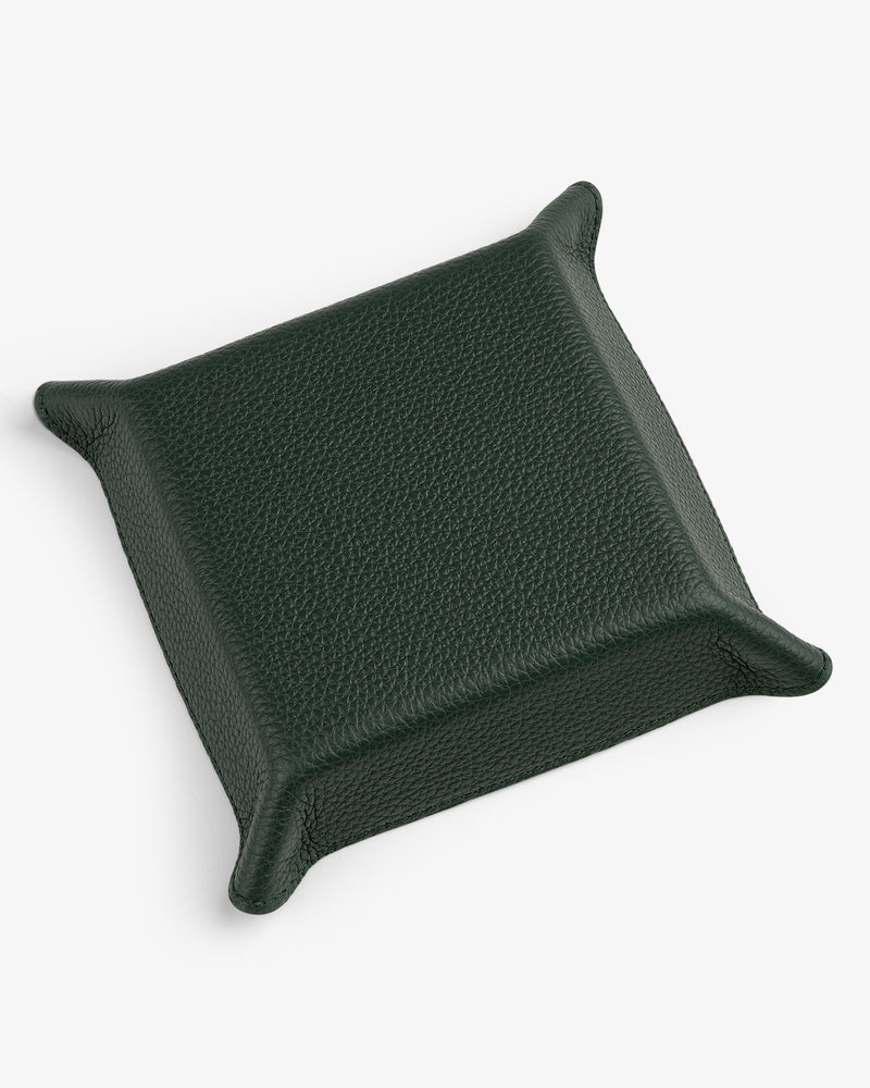 A square dark green Leather Catchall with raised edges and pointed corners on a white background.