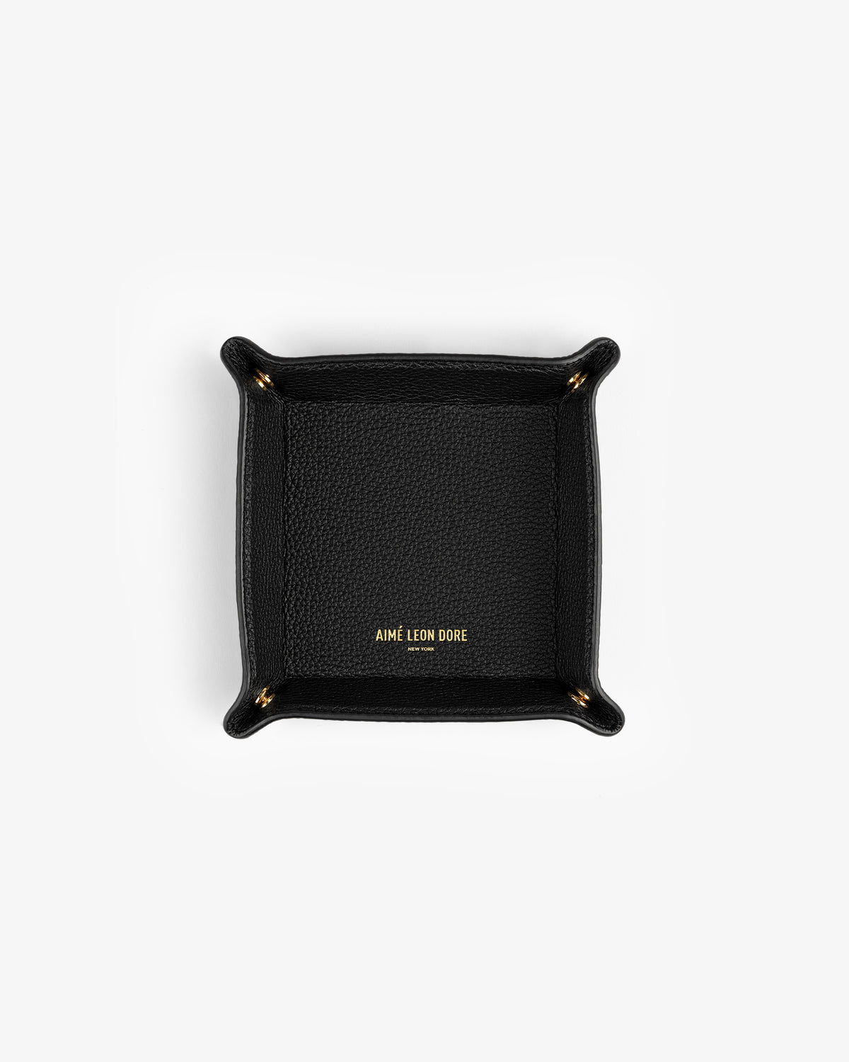Black Leather Catchall with gold AIMÉ LEON DORE text in the center, shown on a white background.