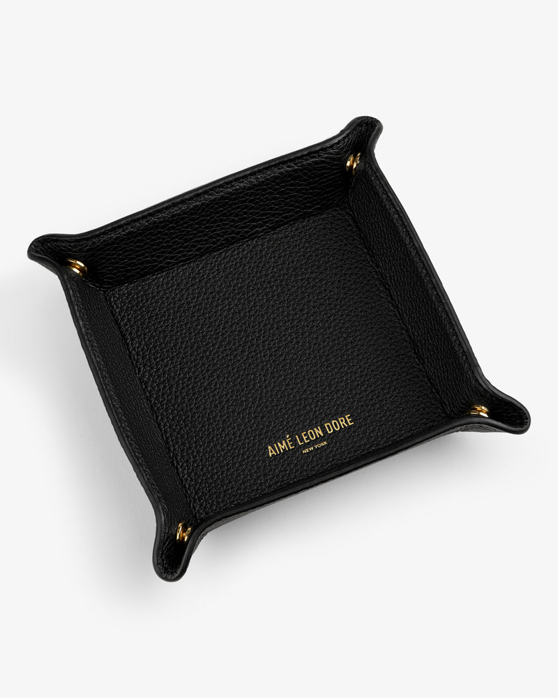 Leather Catchall in black leather with gold "AIMÉ LEON DORE" text, shown on a white background.